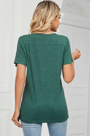 Dark green button-placket henley tee with short sleeves and a relaxed fit.