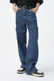 Wide-leg dark wash denim cargo pants with front seam detail and side pockets.