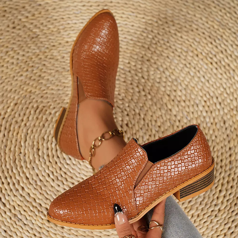 Tan woven texture pointed loafers with block heels and elastic gore.