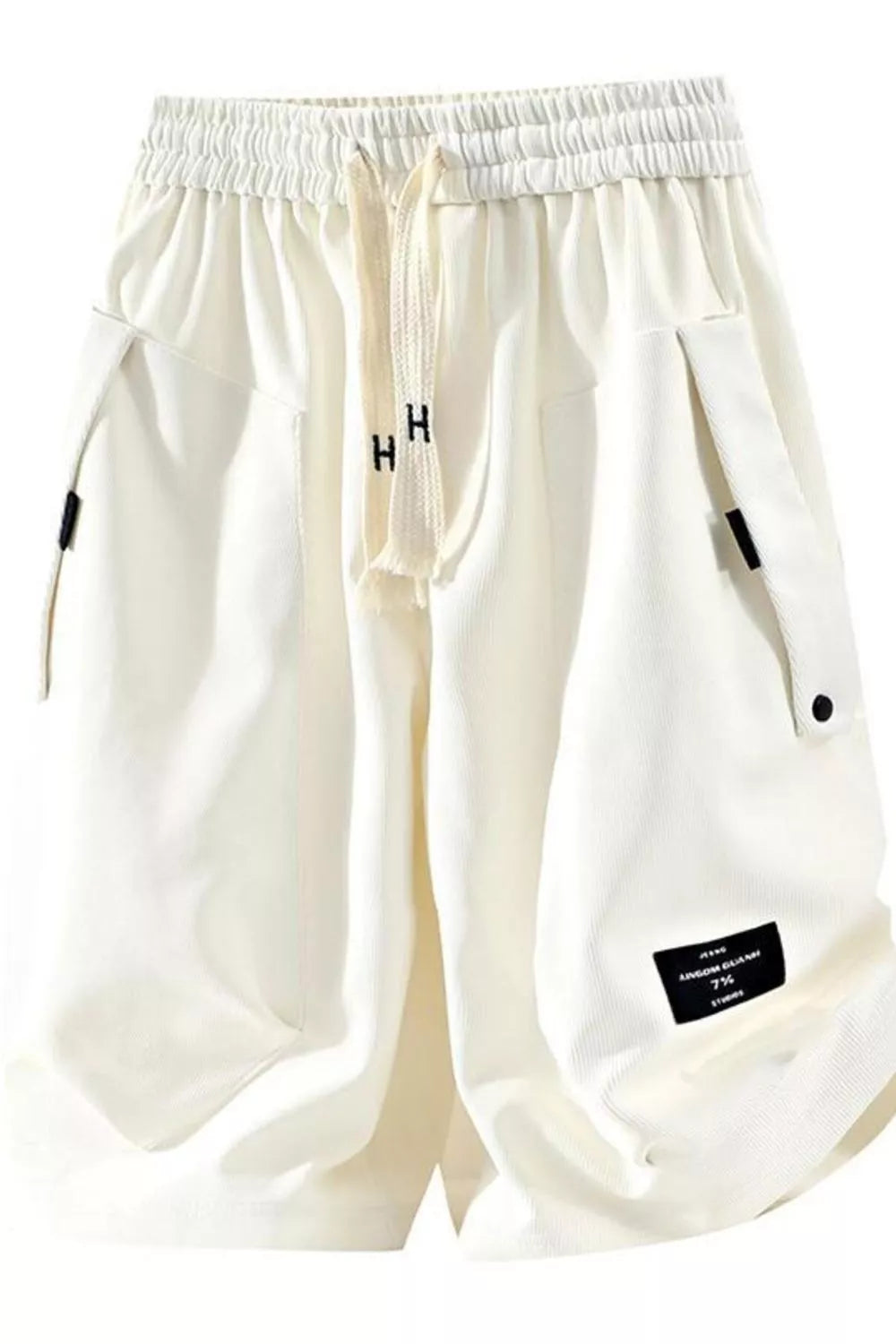 Relaxed fit ivory chino shorts with drawstring and multiple pockets.