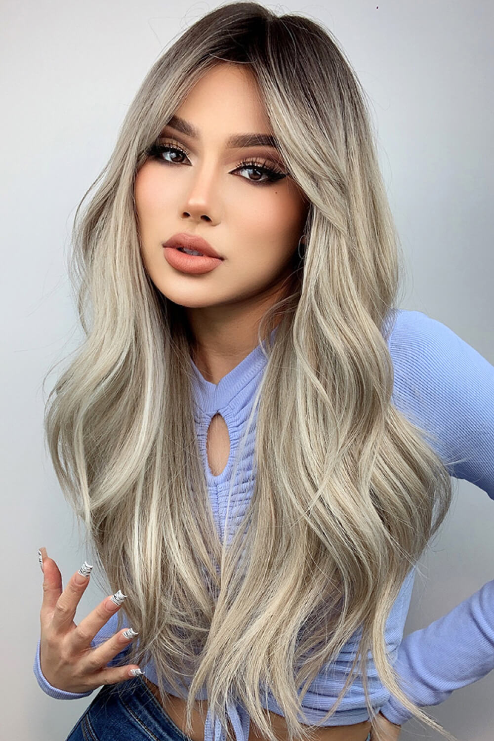 Ombre Wave Frontal Wig in Ash Blonde Balayage with loose waves and dark roots.
