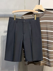 Pleated front casual men's chino shorts in dark gray with a button and zip closure.