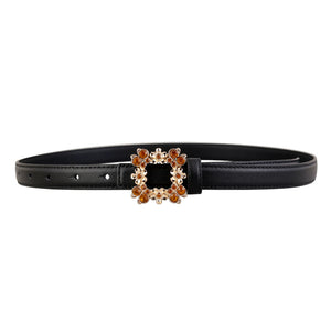 Black leather belt with ornate square buckle embellished with amber rhinestones.