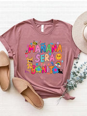 Dusty Pink graphic tee with "Mañana Sera Bonito" text and colorful cartoon illustrations.