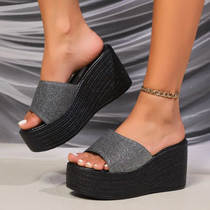 Glitter platform wedge mules in gray with a black textured wedge sole.