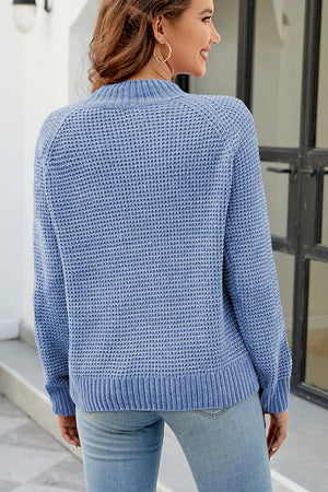 Misty Blue waffle knit raglan sleeve pullover sweater with ribbed cuffs and hem.