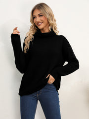Black textured knit oversized turtleneck pullover sweater with a relaxed fit.