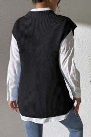 Black textured knit V-neck sleeveless vest over a white button-down shirt
