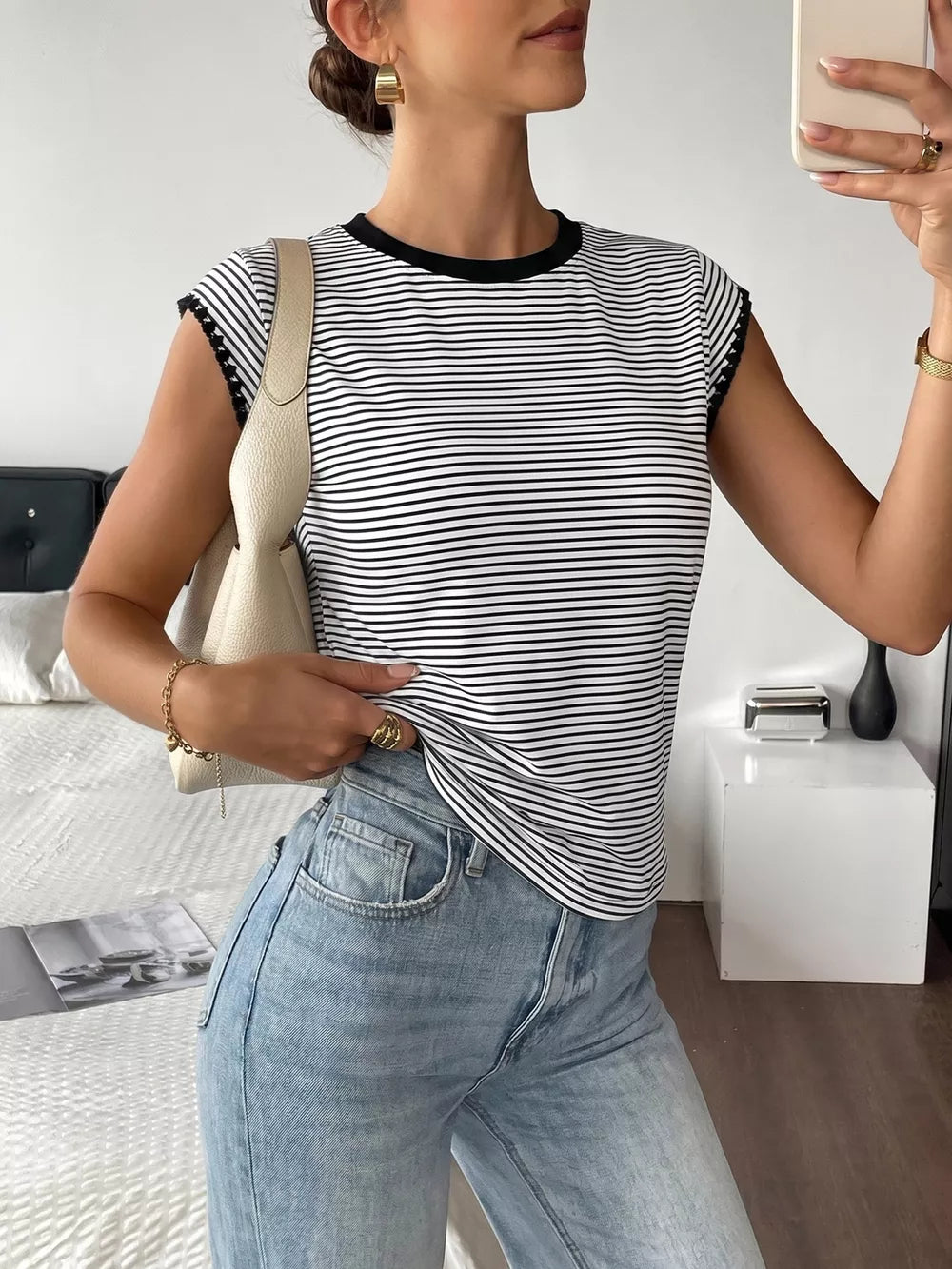 Black and white striped crew neck tee with black trim and cap sleeves.