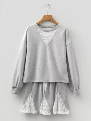 Grey cotton two-piece set with lace trim on neckline and hem.
