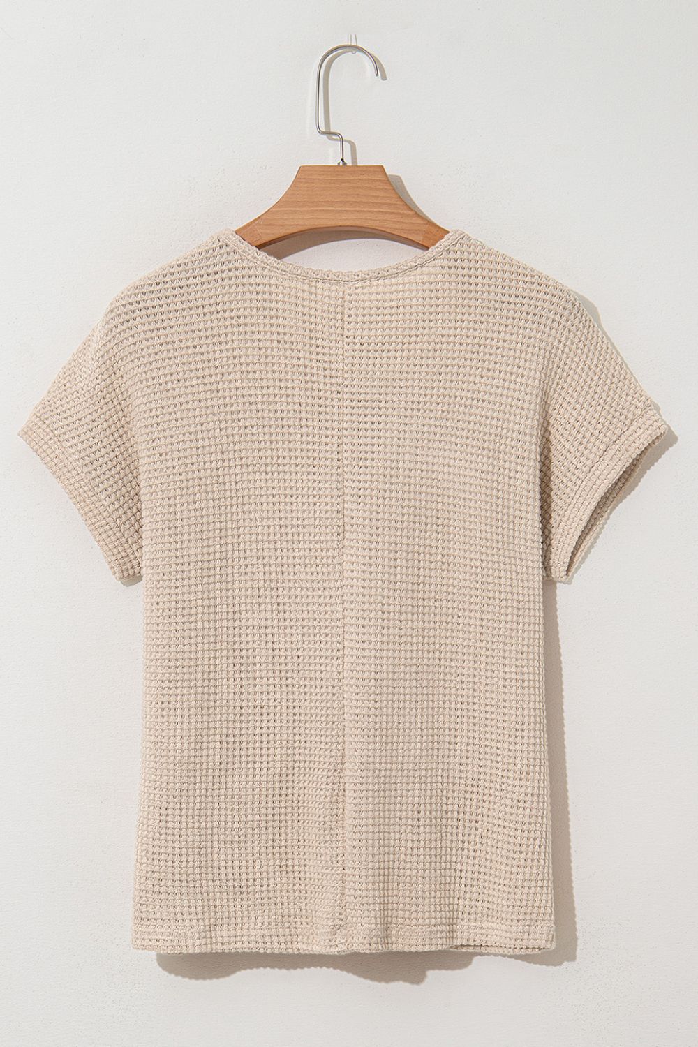 Beige waffle knit top with short sleeves and a lace yoke detail.