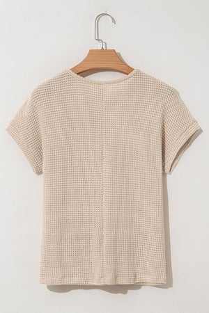 Beige waffle knit top with short sleeves and a lace yoke detail.