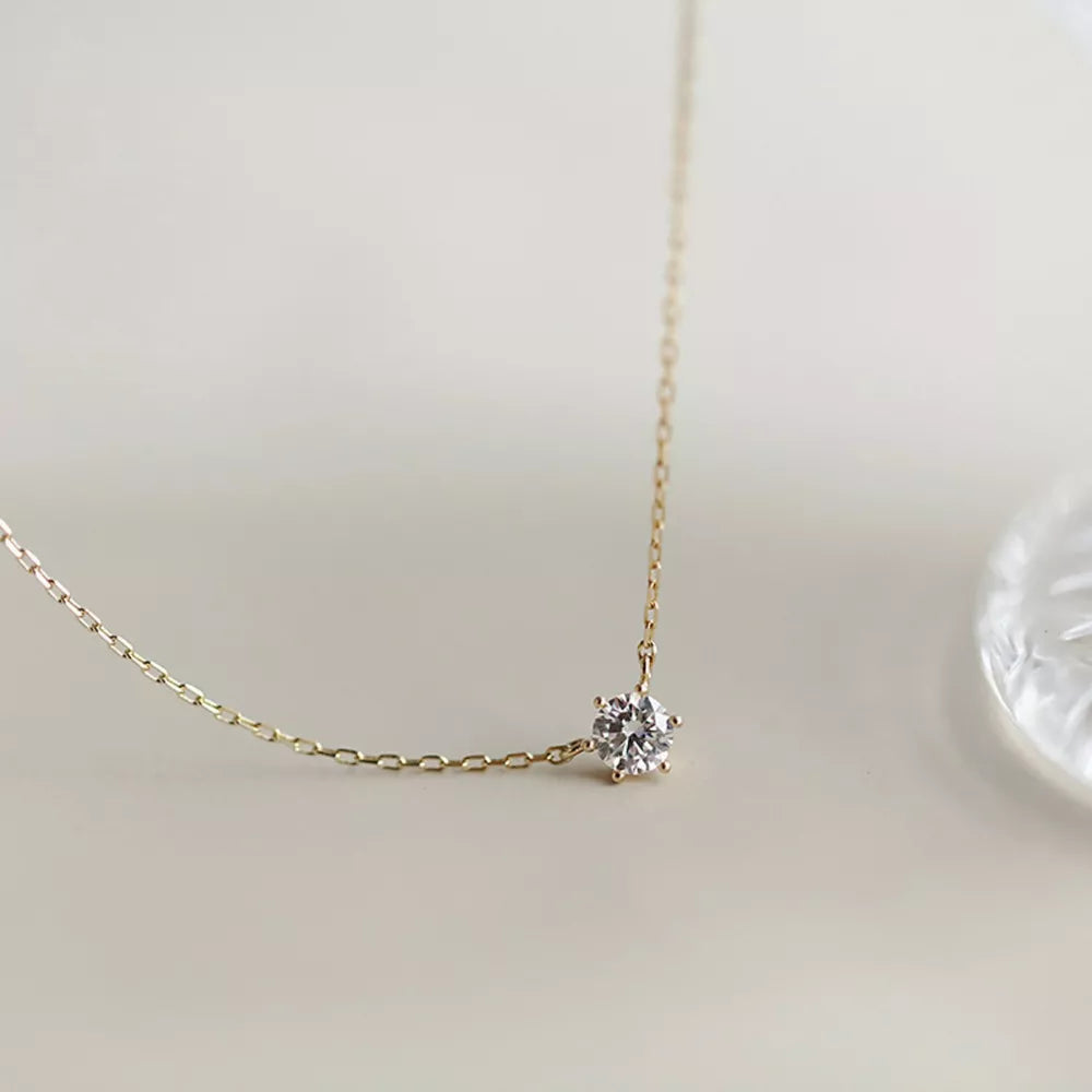 Delicate sterling silver necklace with a clear zircon pendant.