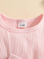 Pink ribbed baby set with a bow detail.