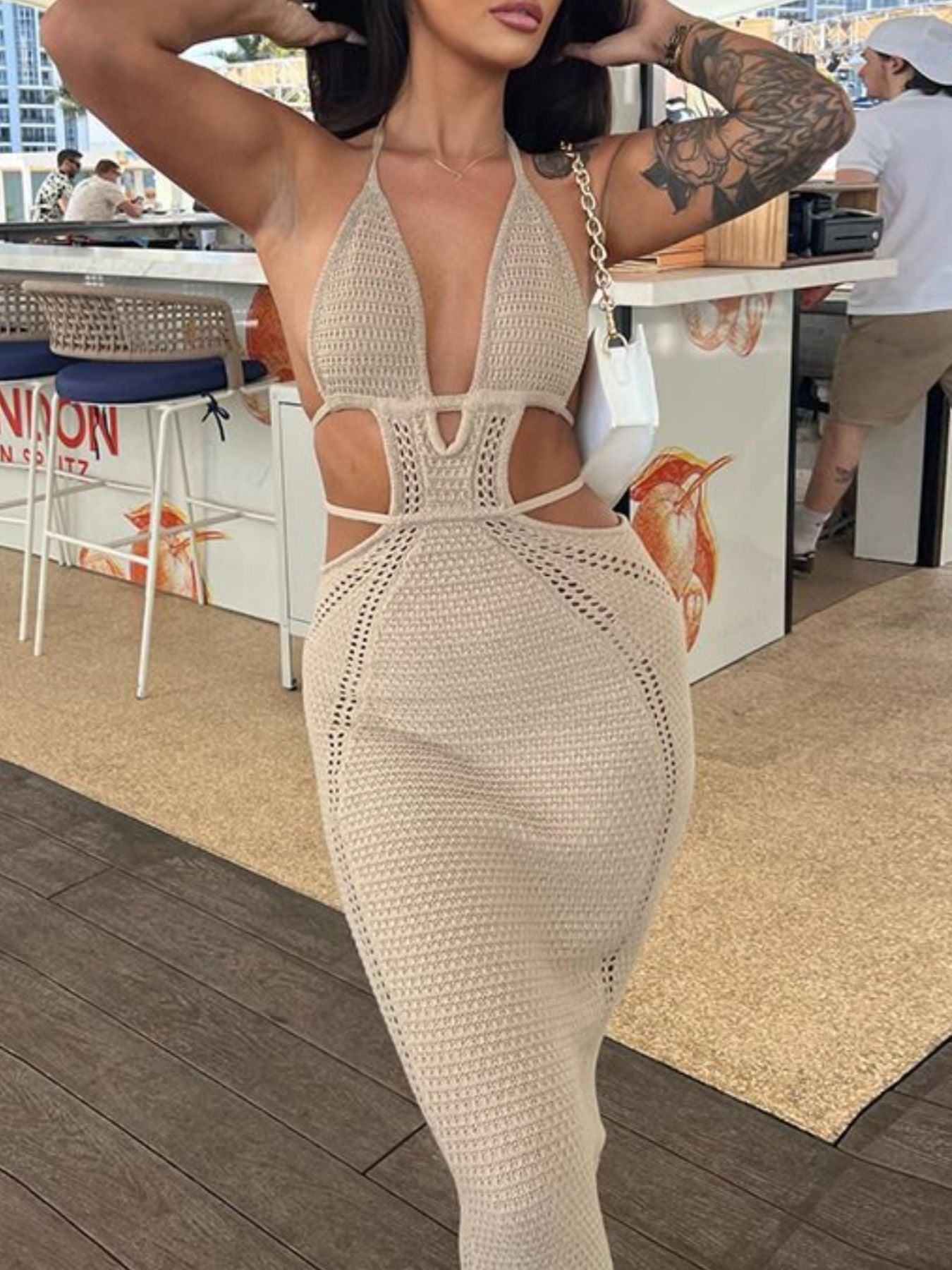 Khaki knitted maxi dress with deep v-neck, cutouts and backless detail