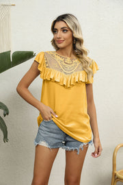 Gold lace yoke ruffle sleeve blouse with short sleeves and a round neckline.
