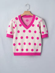 Cream polka dot knit top with hot pink trim and puff sleeves