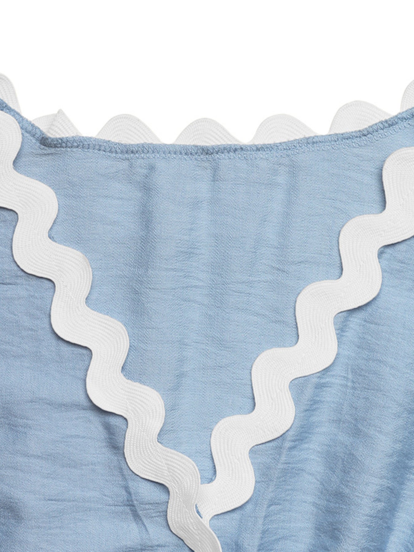 Blue maternity romper cover-up with white scalloped trim detail.