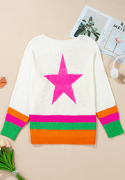 White knit sweater with a large pink star and striped cuffs.