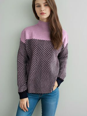 Chevron knit turtleneck sweater in lavender and dark blue with chevron pattern.