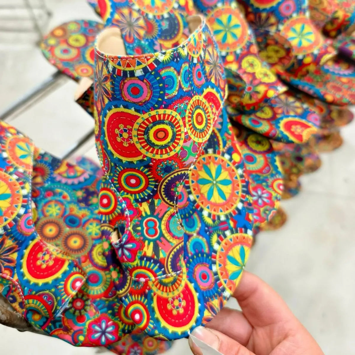 Looped in Flats 3 Sandals with a vibrant, colorful mandala pattern.
