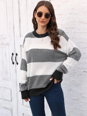 Striped knit crewneck sweater with ribbed trim in black and white acrylic.