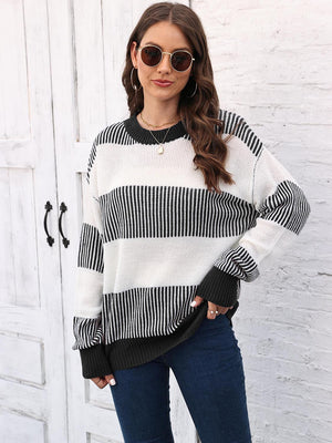 Striped knit crewneck sweater with ribbed trim in black and white acrylic.