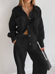 Black textured cotton lounge set with button-down shirt and wide-leg pants