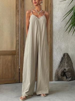 Effortless frill-trimmed sleeveless jumpsuit in beige with wide legs and a flowy fit.