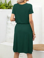 Green midi dress with short sleeves, drawstring waist, and side slits.