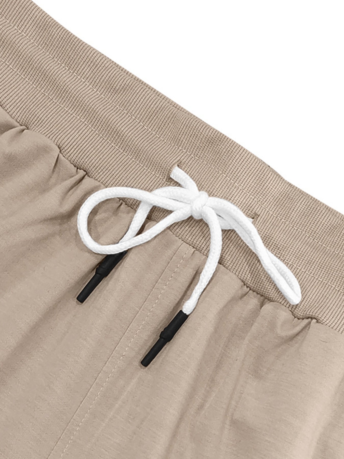 Khaki chino shorts with elastic waistband and white drawstring with black tips.