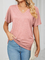 Relaxed pink V-neck short sleeve t-shirt with draping and a soft texture.