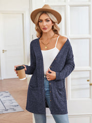 Peacock Blue textured ribbed knit button-down cardigan with pockets and a relaxed fit.