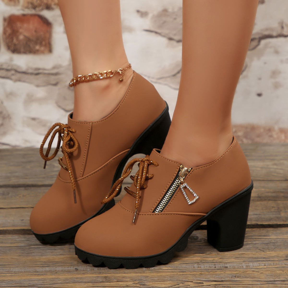 Brown lace-up high heel pumps with side zipper and chunky block heel.