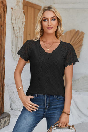 Black eyelet raglan blouse with lace short sleeves and scalloped neckline.