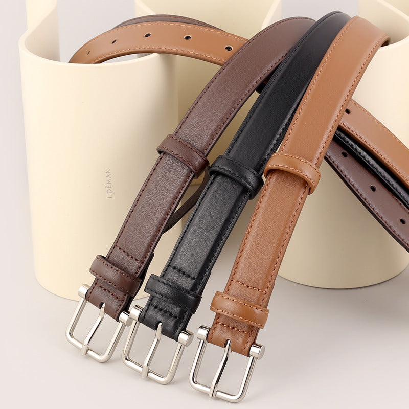 Classic cowhide leather belts in black, brown, and caramel with silver buckles.