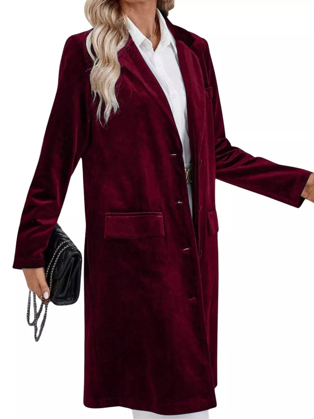 Burgundy velvet longline trench coat with lapel collar and buttoned front.