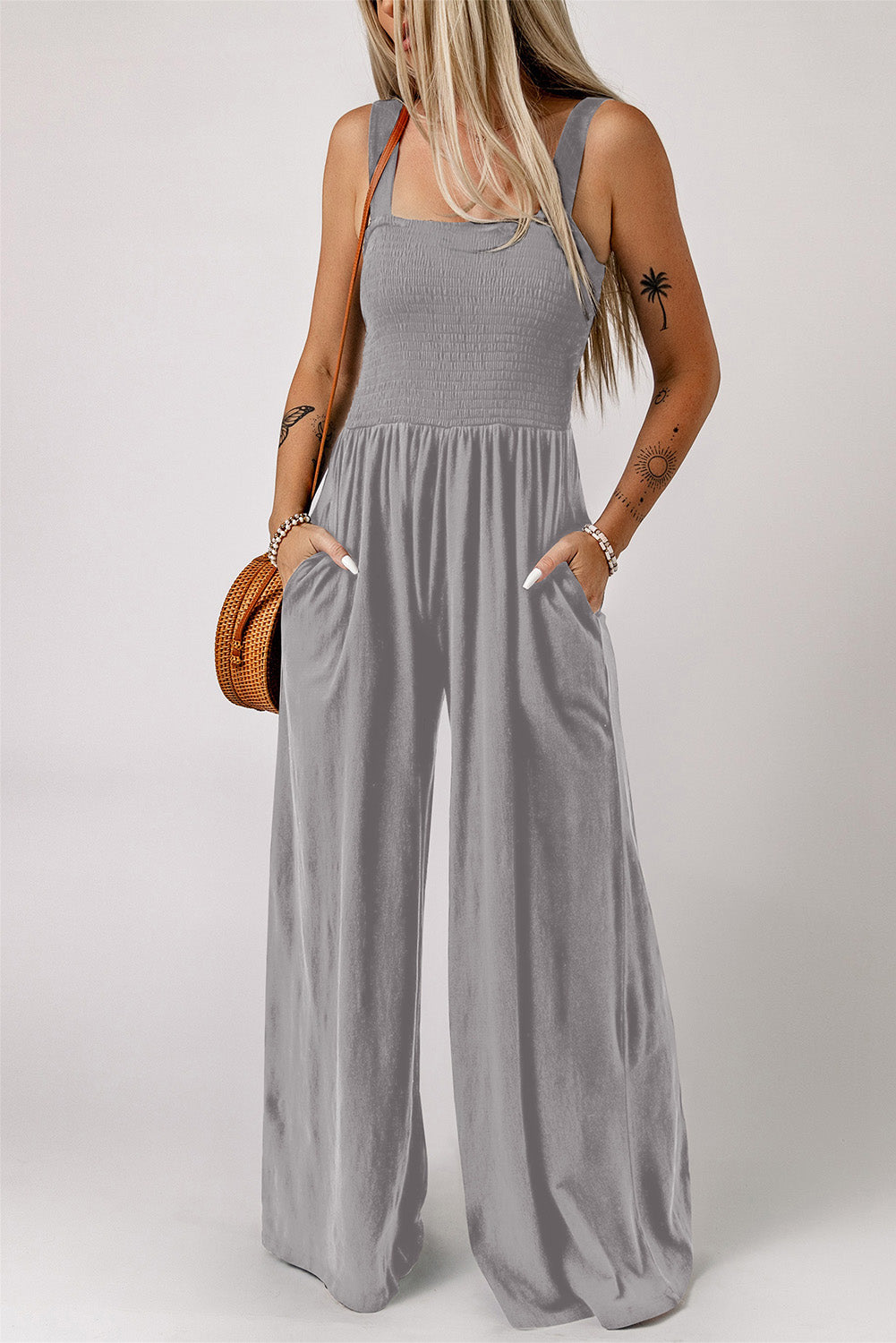 Sway Square Smocked Jumpsuit in grey with wide legs and pockets.