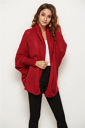 Textured cocoon knit cardigan in deep red with batwing sleeves and a shawl collar.