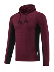 Men's burgundy geometric hooded sweatshirt with black side panels and drawstring hood.