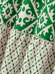 Tiered maxi skirt in green and white medallion print with ruffled tiers.