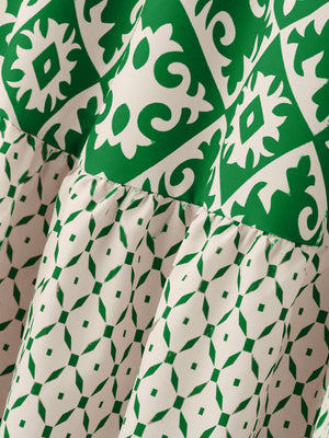 Tiered maxi skirt in green and white medallion print with ruffled tiers.