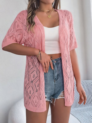 Blush pink open-knit cardigan with diamond pattern and short sleeves.