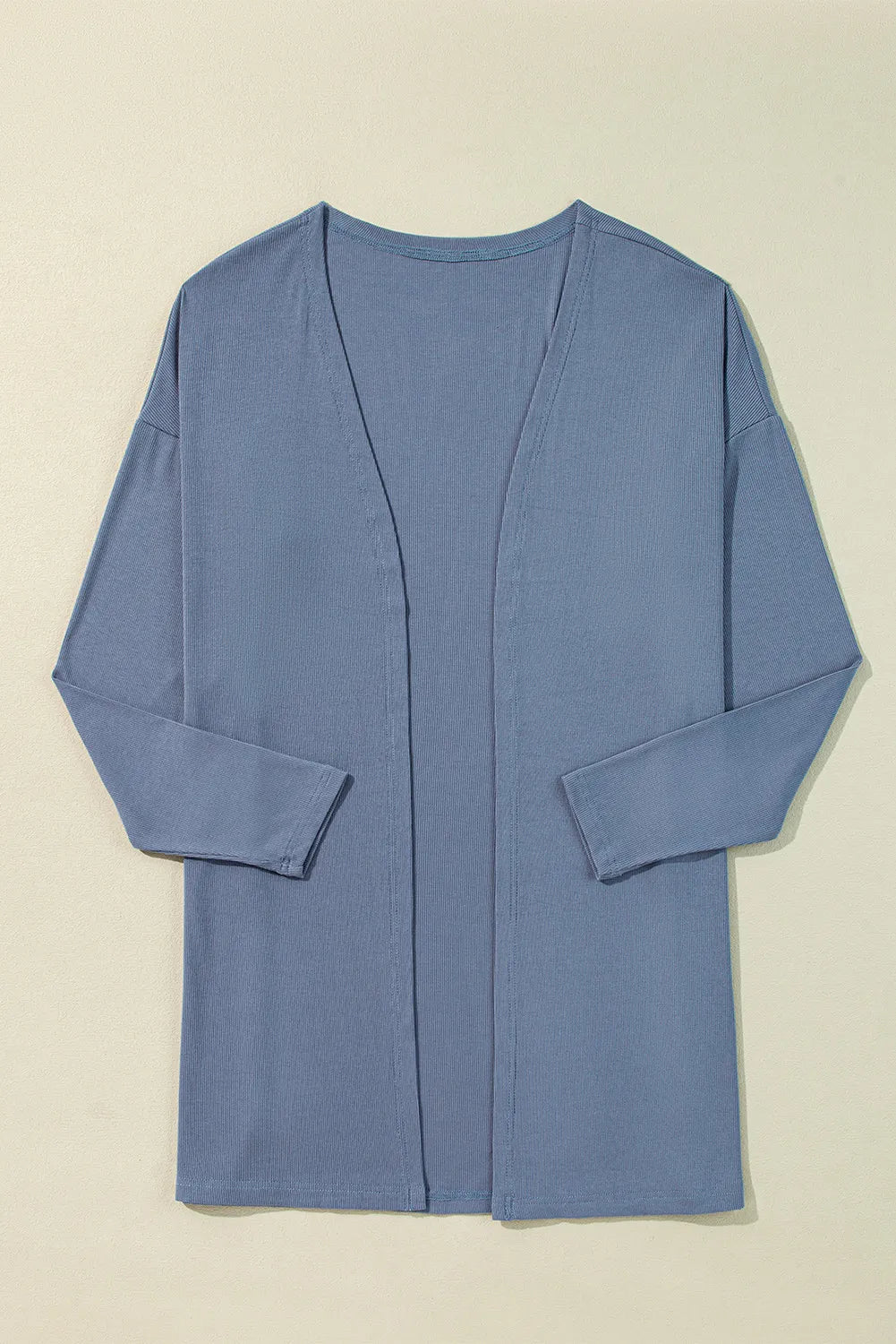 Dusty blue ribbed knit open front cardigan with long sleeves and side slits.