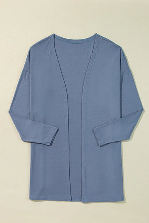 Dusty blue ribbed knit open front cardigan with long sleeves and side slits.