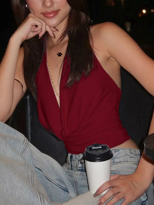 Burgundy halter ruched cami top with deep V-neck and knot detail.