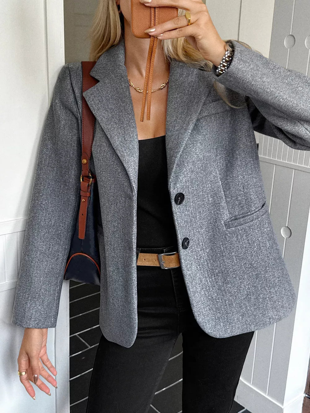 Gray lapel blazer with button closure and pocket detail