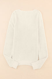 Relaxed knit V-neck pullover sweater in beige with ribbed cuffs and hem.