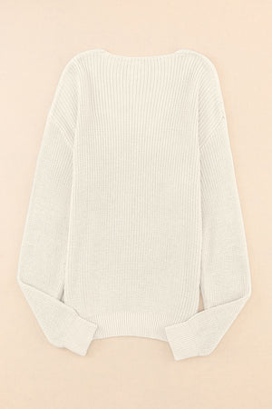 Relaxed knit V-neck pullover sweater in beige with ribbed cuffs and hem.