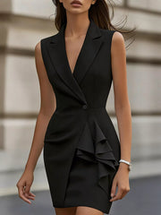 Black lapel collar sleeveless dress with cascading ruffles and a single button closure.